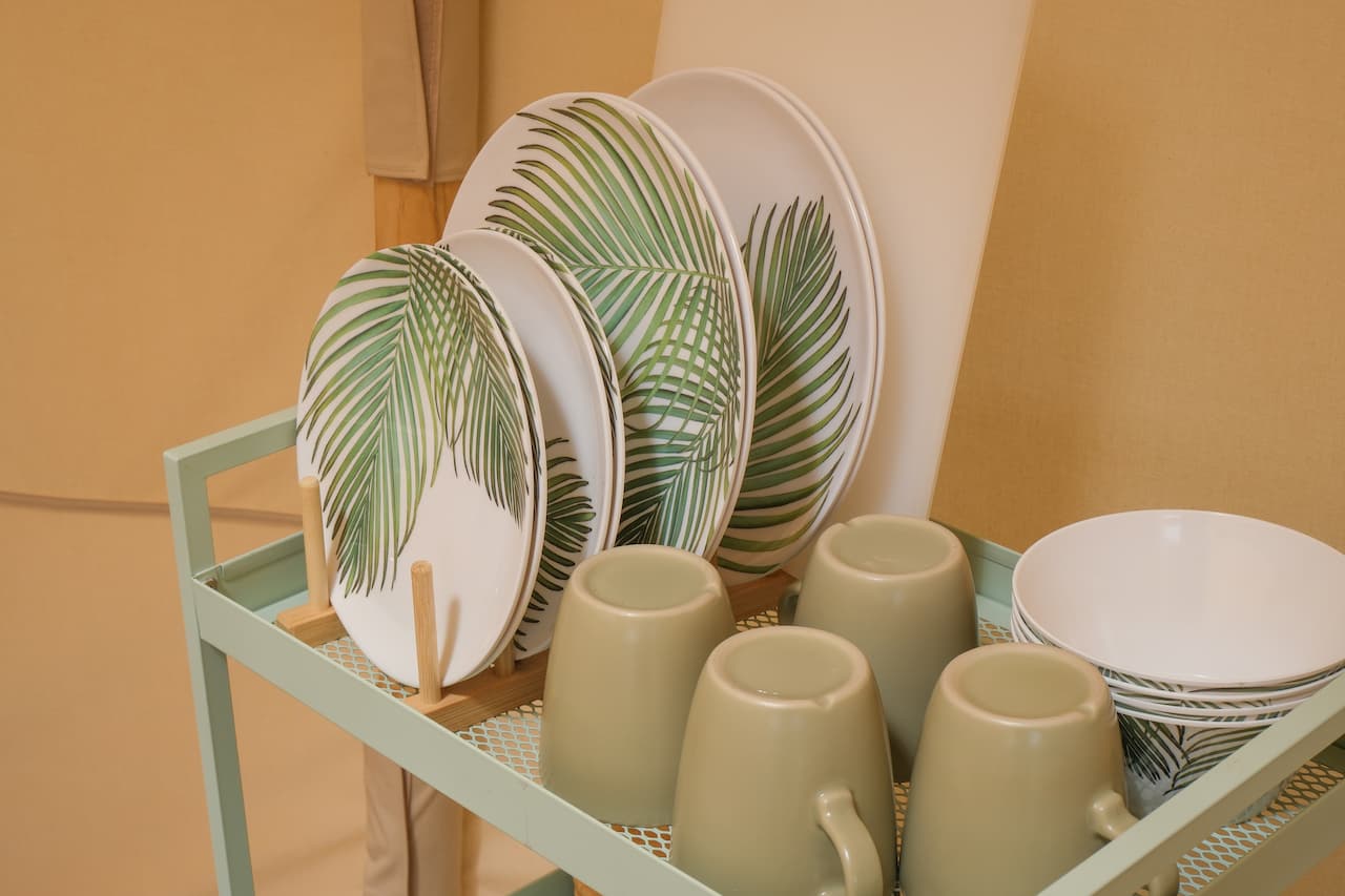 Plates, bowls and mugs provided inside a glamping bell tent
