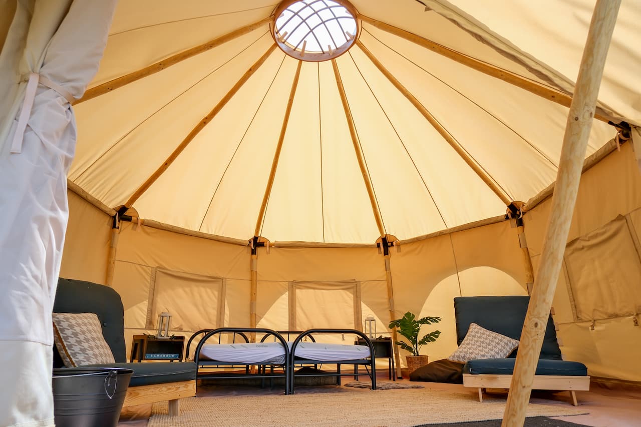 Spacious interior of a Burt glamping tent at Ashurst Campsite